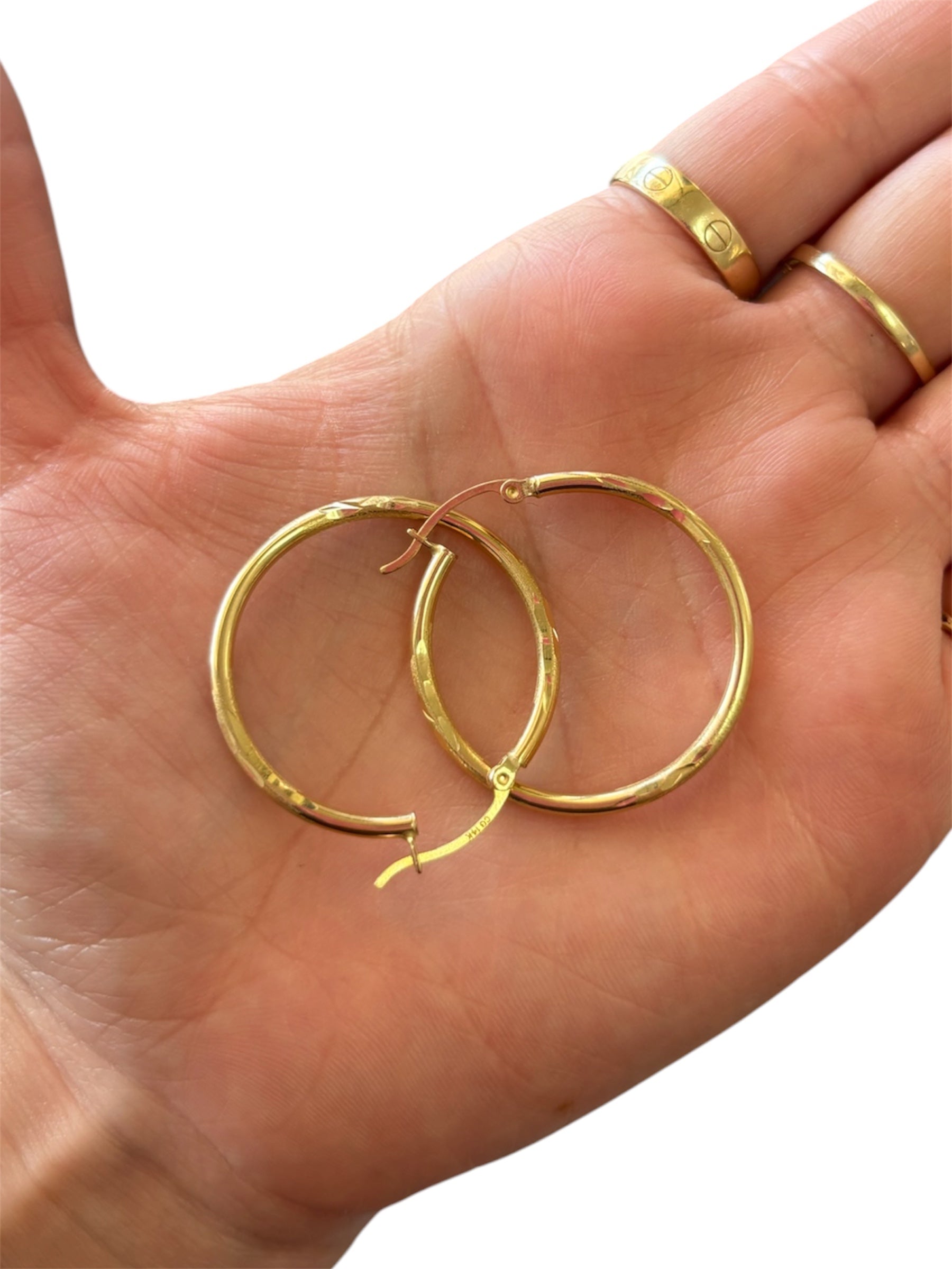 Hoop earrings with cut designs